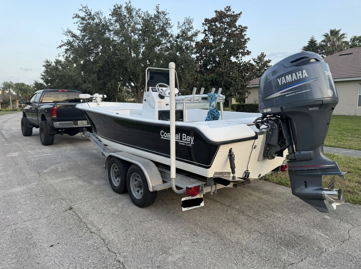 Captain Brendan's Coastal Bay center console boat rigged with a Yamaha outboard, ready to launch